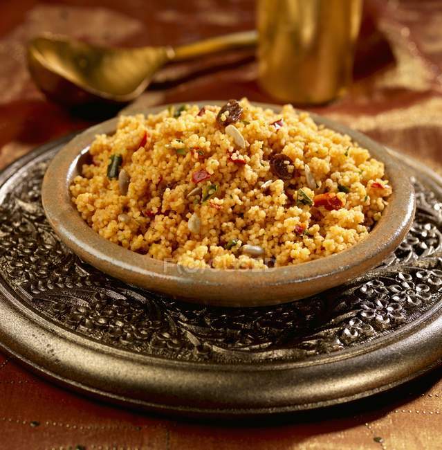 Spicy couscous with raisins and sunflower seeds — Stock Photo