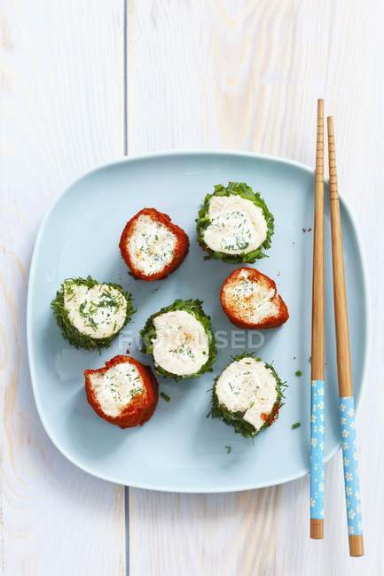 Slices of toast roulade with herbs and pepper — Stock Photo