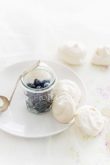 Closeup view of pavlovas with fresh blueberries in jar — Stock Photo
