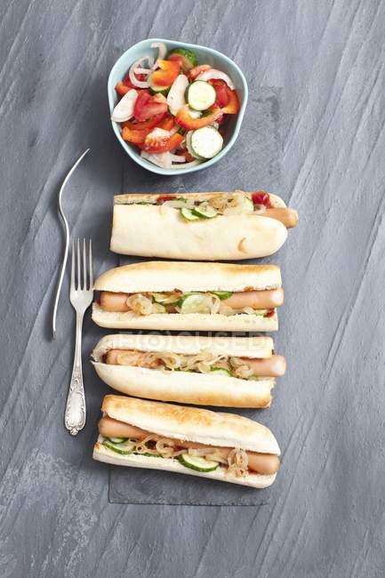 Hot dogs with gherkins and onion relish — Stock Photo