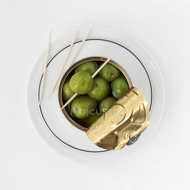 Tin of green olives — Stock Photo