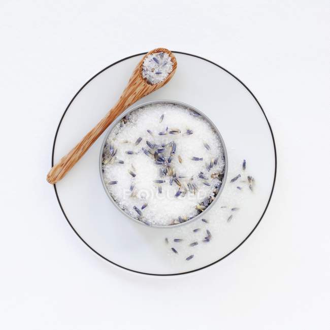 Top view of a pot of lavender sugar on a saucer with a spoon — Stock Photo