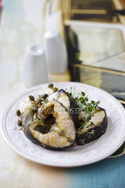Sturgeon steaks with capers — Stock Photo