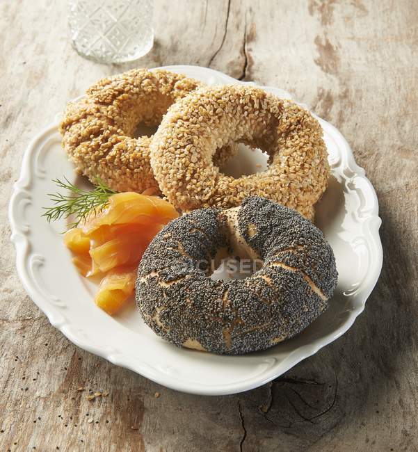 Three different bagels with smoked salmon — Stock Photo