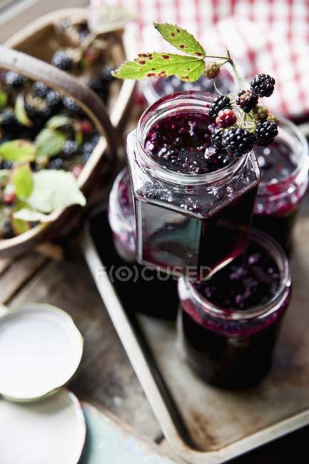 Blackberry jam in stacked jars — Stock Photo