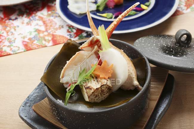 Clams with turnips in bowl — Stock Photo