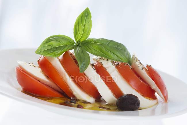Layers of tomato and mozzarella — Stock Photo