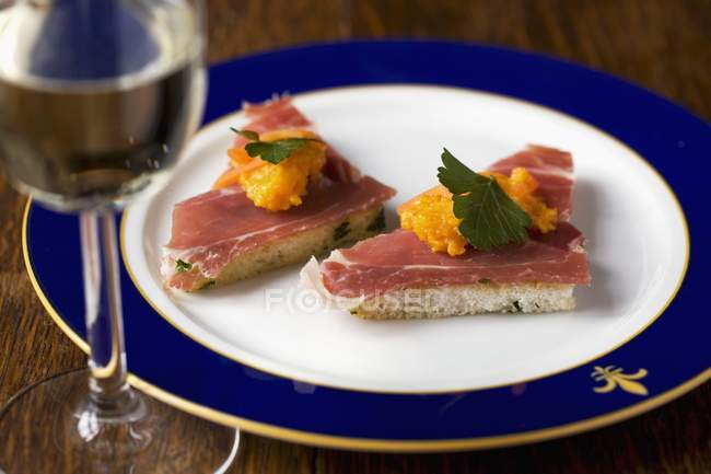Toast triangles with ham — Stock Photo