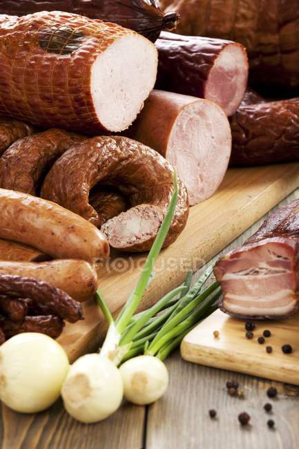 Various cold cuts with onions — Stock Photo