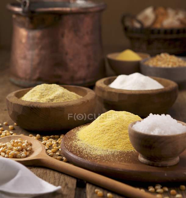 Closeup view of an arrangement of Polenta, salt and corn kernels — Stock Photo