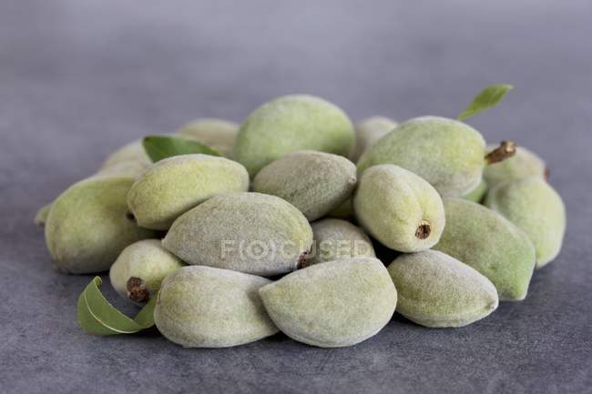 Pile of green fresh almonds — Stock Photo