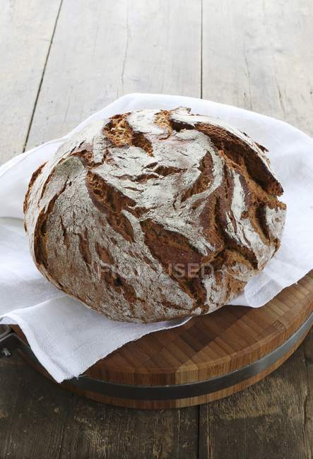 Rustic loaf of country bread — Stock Photo