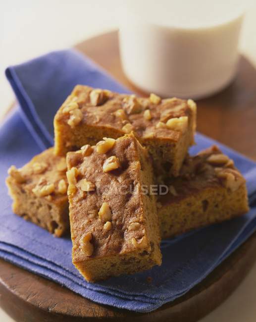 Closeup view of Blondies with pecan nuts on purple towel — Stock Photo