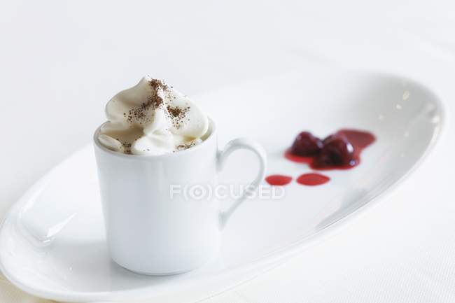 Closeup view of Espresso topped with cream and cocoa — Stock Photo