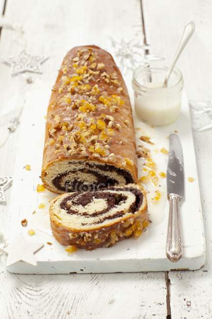 Elevated view of poppy seed Roulade with nuts and cream — Stock Photo