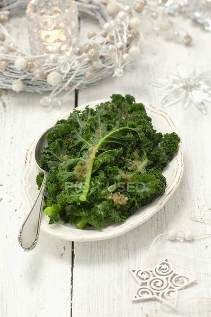 Green kale with buttered crumbs — Stock Photo