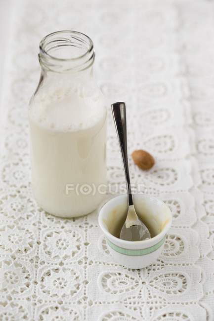 Almond milk made from almond mousse — Stock Photo