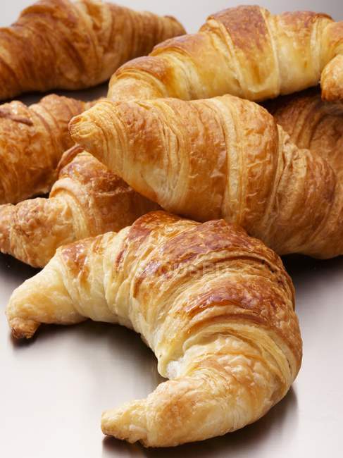 Stack of fresh and sweet croissants — Stock Photo