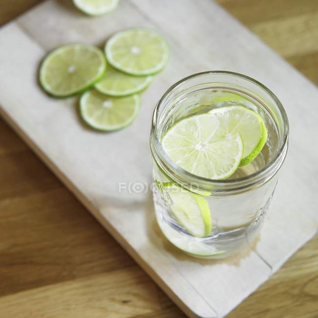 Water with slices of lime — Stock Photo