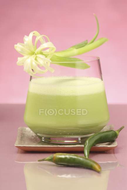 Green gazpacho drink with chili peppers — Stock Photo