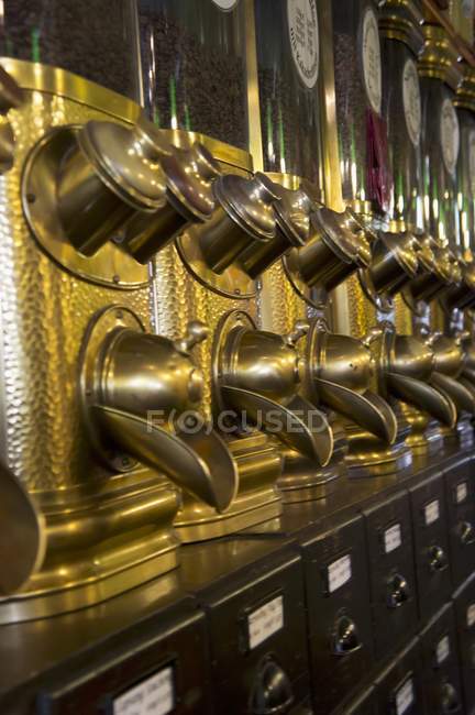 Closeup view of coffee beans in a coffee machines row — Stock Photo