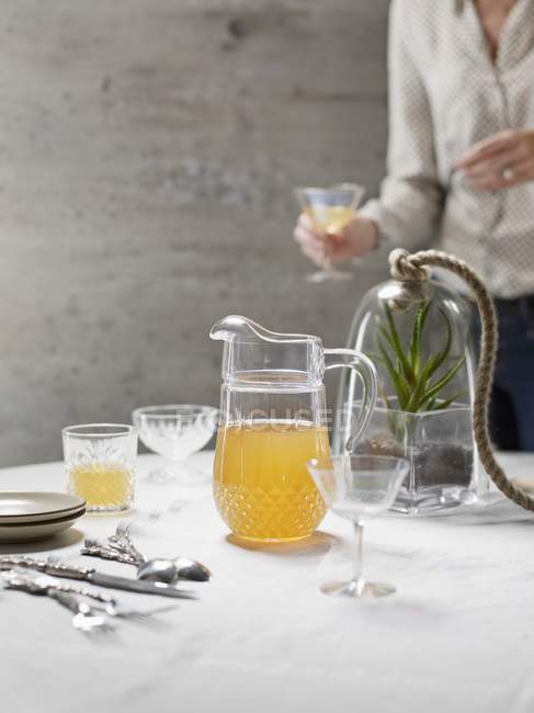 Jug of punch on a table — Stock Photo