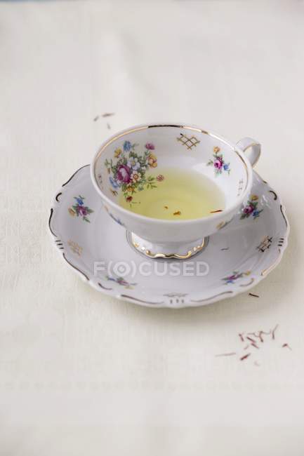 Closeup view of saffron water in cup — Stock Photo