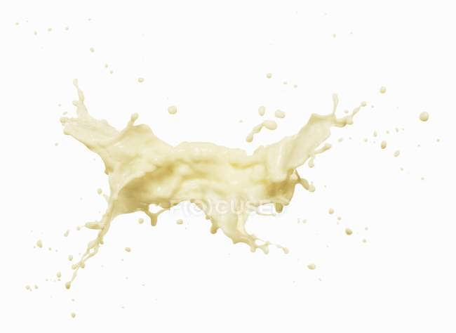 Splash of banana milkshak — Stock Photo