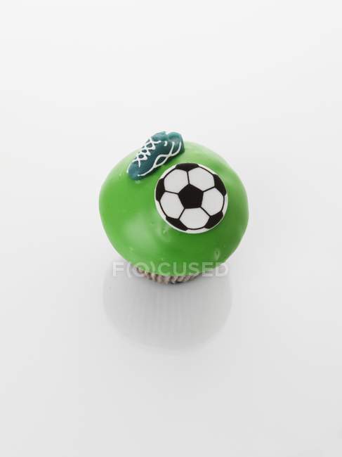 Cupcake decorated with football motifs — Stock Photo