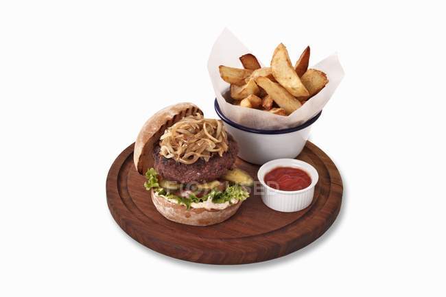 Hamburger with ketchup and fries — Stock Photo