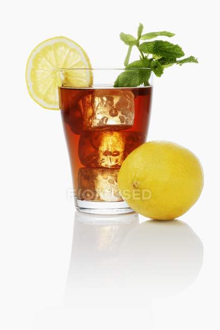 Iced tea with lemon and mint — Stock Photo