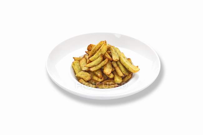 Plate of herb potato fries — Stock Photo
