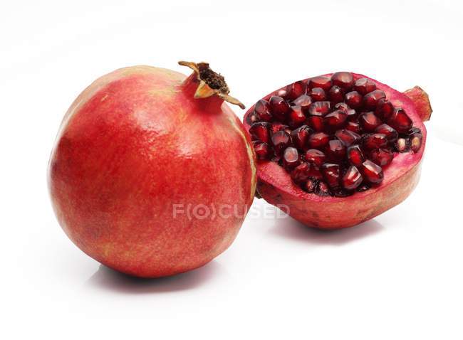 Fresh pomegranate with half — Stock Photo