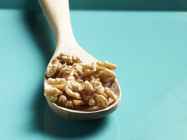 Walnuts on a Wooden Spoon — Stock Photo