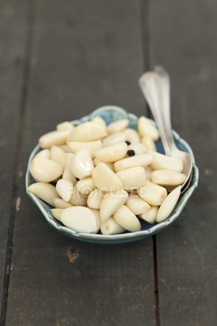 Marinated garlic cloves — Stock Photo