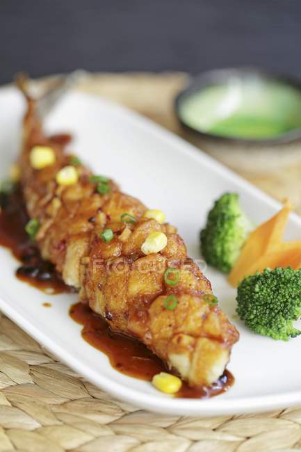 Crispy sea bass with soy sauce — Stock Photo