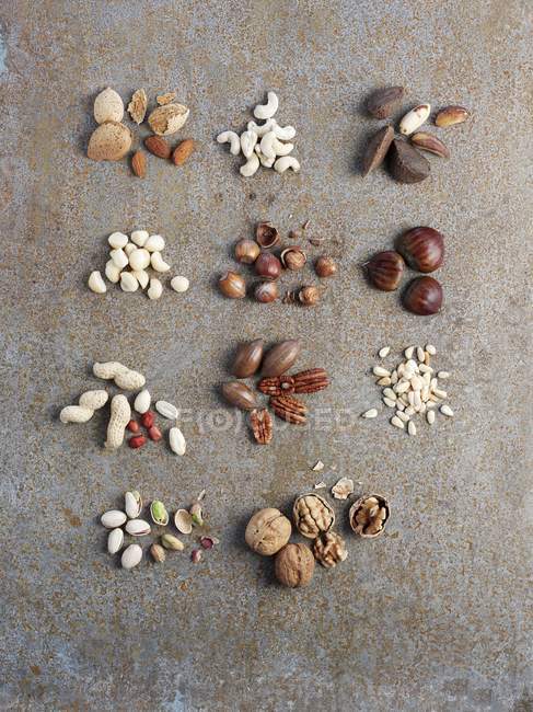Assorted shelled and unshelled nuts — Stock Photo