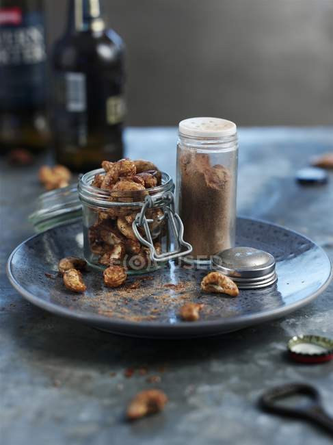 Spicy cashews nuts in jar — Stock Photo