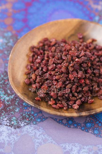 Dried Barberries on wooden plate — Stock Photo