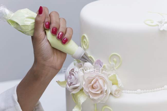 Cake decorated by hand — Stock Photo
