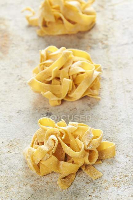 Fresh homemade tagliatelle pasta — Stock Photo