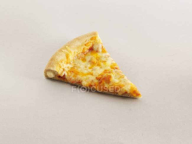 Slice of crust cheese pizza — Stock Photo