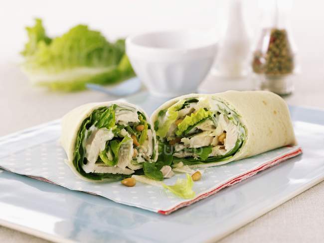 Closeup view of chicken wraps with lettuce in flat bread — Stock Photo