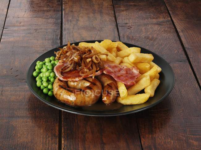Cumberland sausage with bacon — Stock Photo