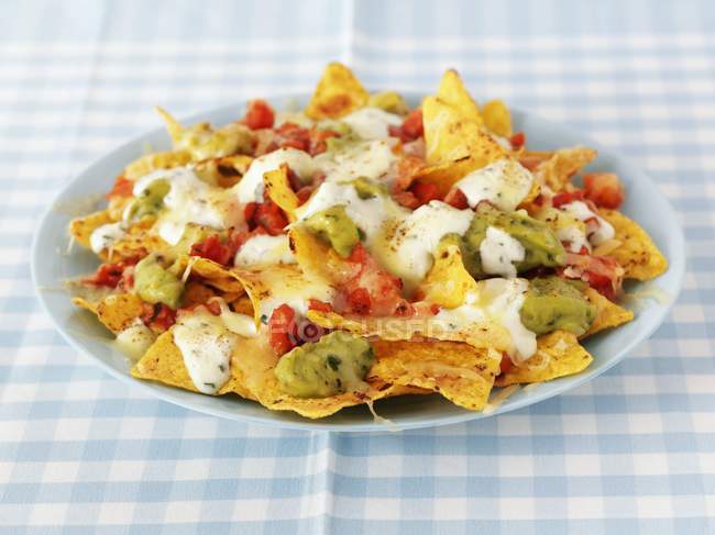 Nachos with cheese on plate — Stock Photo