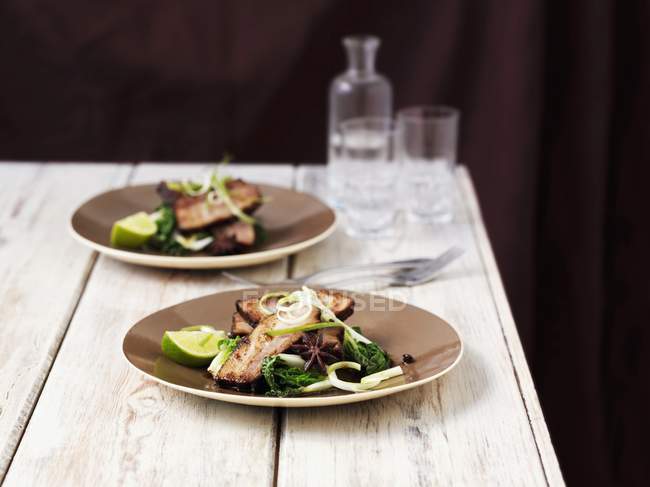 Pork belly with limes — Stock Photo