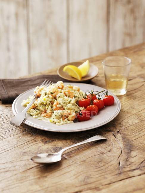 Seafood risotto with tomatoes — Stock Photo