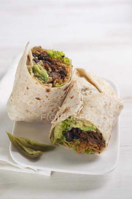 Burrito filled with beans and tomato rice — Stock Photo