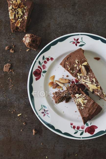 Slices of chocolate cake with almonds — Stock Photo