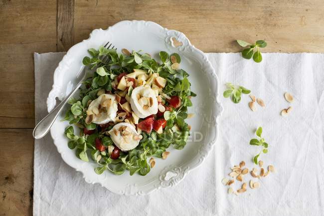 Goat's cheese with almonds — Stock Photo